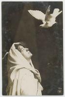 [Woman posed in religious robes with prop dove] 431/3