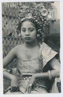 [Serious woman in Balinese costume