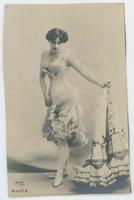 [Woman posed in ruffled camisole with necklace]