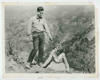 [Tom Mix with rope around waist; lady co-star on knees from "Mr. Logan U.S.A."]