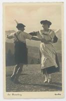 [German man and woman dancing in traditional clothing]