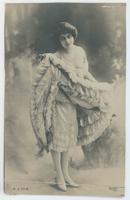 [Woman posed with ruffled dress and camisole]