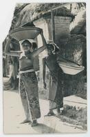 [Two young girls in Balinese with baskets]