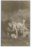 [Woman posed in ruffled dress, feather boa and a dog in faux outdoor setting] 605/8