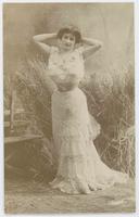 [Woman posed in ruffled dress in faux outdoor setting] 605/4