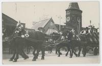 [Beer wagon with harnessed horses outside Oktoberfest beer hall]