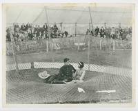 [Still:  Tom Mix in Circus Ace- Mix in trapeze net]