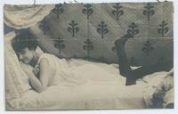 [Woman in lace camisole on her bed]