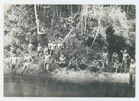 [Group of native Venezuelan people next to river]