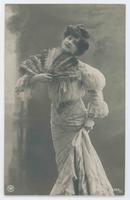 [Woman posed in ruffled dress with feather fan] 988/2