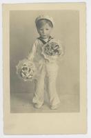 [Male doll in sailor suit holding flowers]