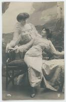 [Two women posed together on a settee] 1336/3