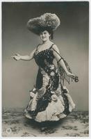 [Woman posed in ruffled and sequined dress with ribboned hat] 422/10