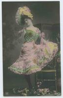 [Woman posed in ruffled and sequined dress with frilly hat] 1136/4