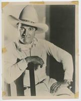 [Portrait of Tom Mix sitting on a chair]