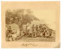 Kirby and Cree's Outfit [Group of cowboys posing for photograph in their camp]