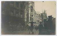 [Ornate buildings with policeman directing traffic]