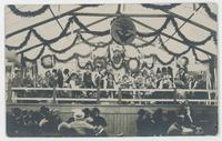 [Oktoberfest band on bandstand]