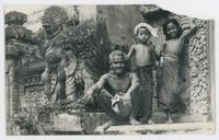[Old man and two children in Balinese costume]