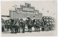[Beer wagon with harnessed horses outside Oktoberfest beer hall]