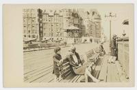 [Dufferin Terrace in Quebec with people sitting on benches]