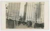 [New York buildings with carriages on street]