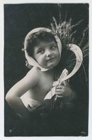 [Little girl holding sickle and sheaf of grain]