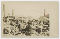 [Unidentified ship at busy wharf]