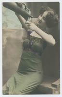 [Woman posed in silk dress with goblet and pitcher] 1006/6