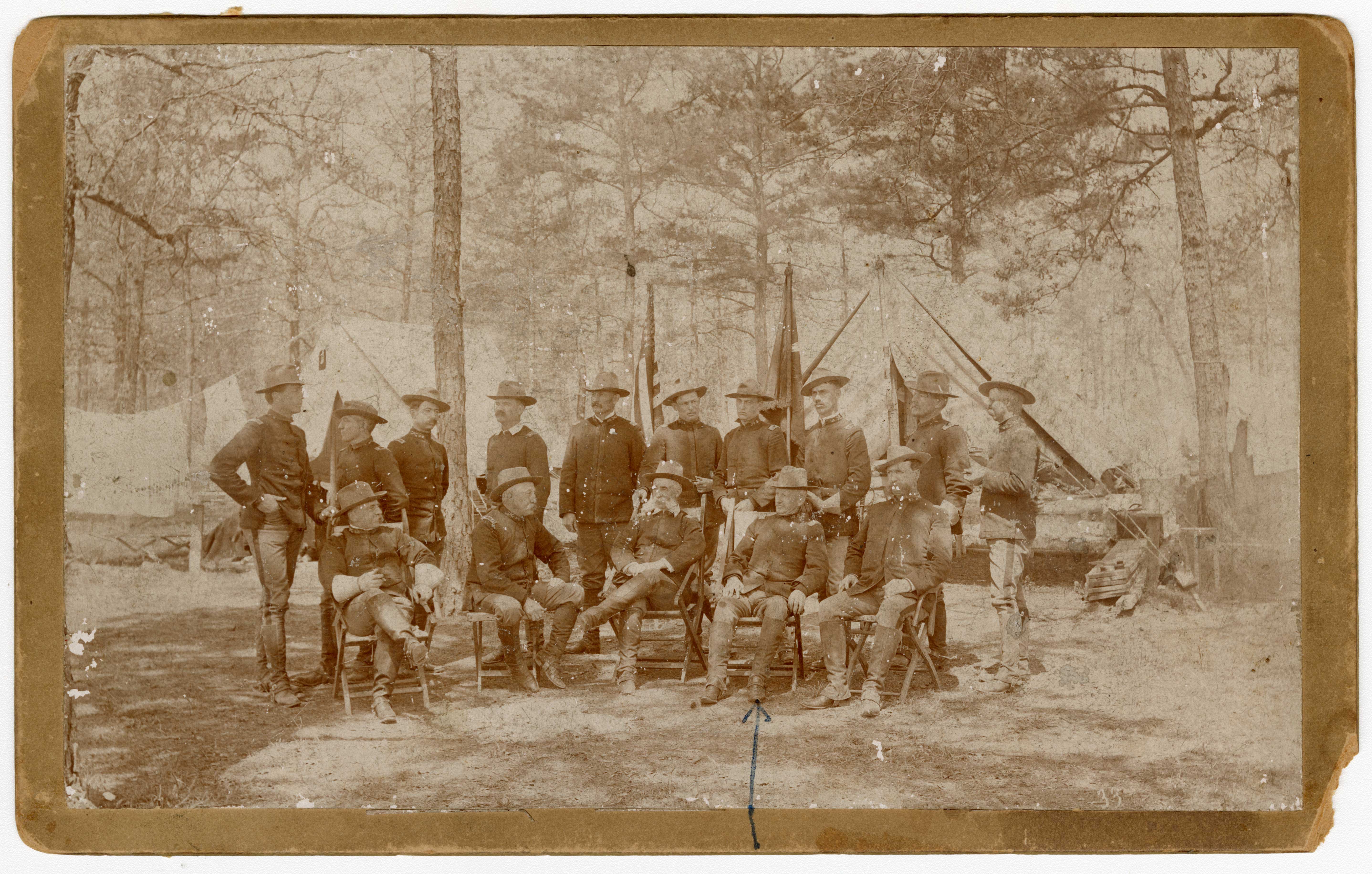 [Group portrait of officers, including Lt. Colonel John M. Hamilton, in camp...