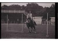 Unidentified rider in Pole bending event