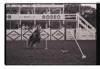 Unidentified rider in Pole bending event