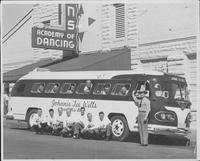 Johnnie Lee Wills and band [the band's bus is sitting in front of an academy of dancing]