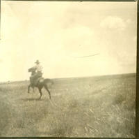 [Cowboy on galloping horse]
