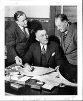 Tulsa, Okla [Foghorn Clancy and 2 other men, at a desk]
