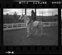 [Unknown Cowgirl on horseback]