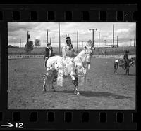 [Unknown Cowgirl on horseback]