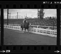 [Unknown Cowgirl on horseback]