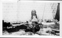 July 1928 Time Exposure of Squaw "The Bread" taken in her tent. She had a broken ankle