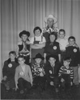 [Gene Autry and school children posing for photograph]