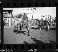 [Unknown Cowboy on horseback]