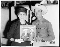 [Man & woman holding album cover, Bob Wills and Tommy Duncan on front]