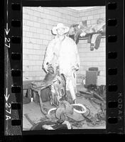 Portrait photograph Ross Loney wearing a fur coat in clown room