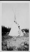 Aug. 1928 Assembling a teepee
