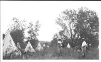 Our camp probably at Ashland Rodeo 1928 from Quarter Circle U Ranch; Flo Scully in foreground