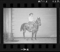 [Unknown Cowboy on horse back]