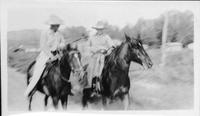 [Two persons on horses]