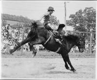 Oops! He blew a stirrup-there will be an early fall, J.E. Ranch Rodeo, Waverly, N.Y.