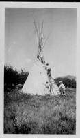 Assembling Mrs. Arnold's teepee Aug. 1928