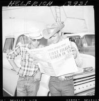 R.C. Bales & Bill Watts reading Rodeo Sports News